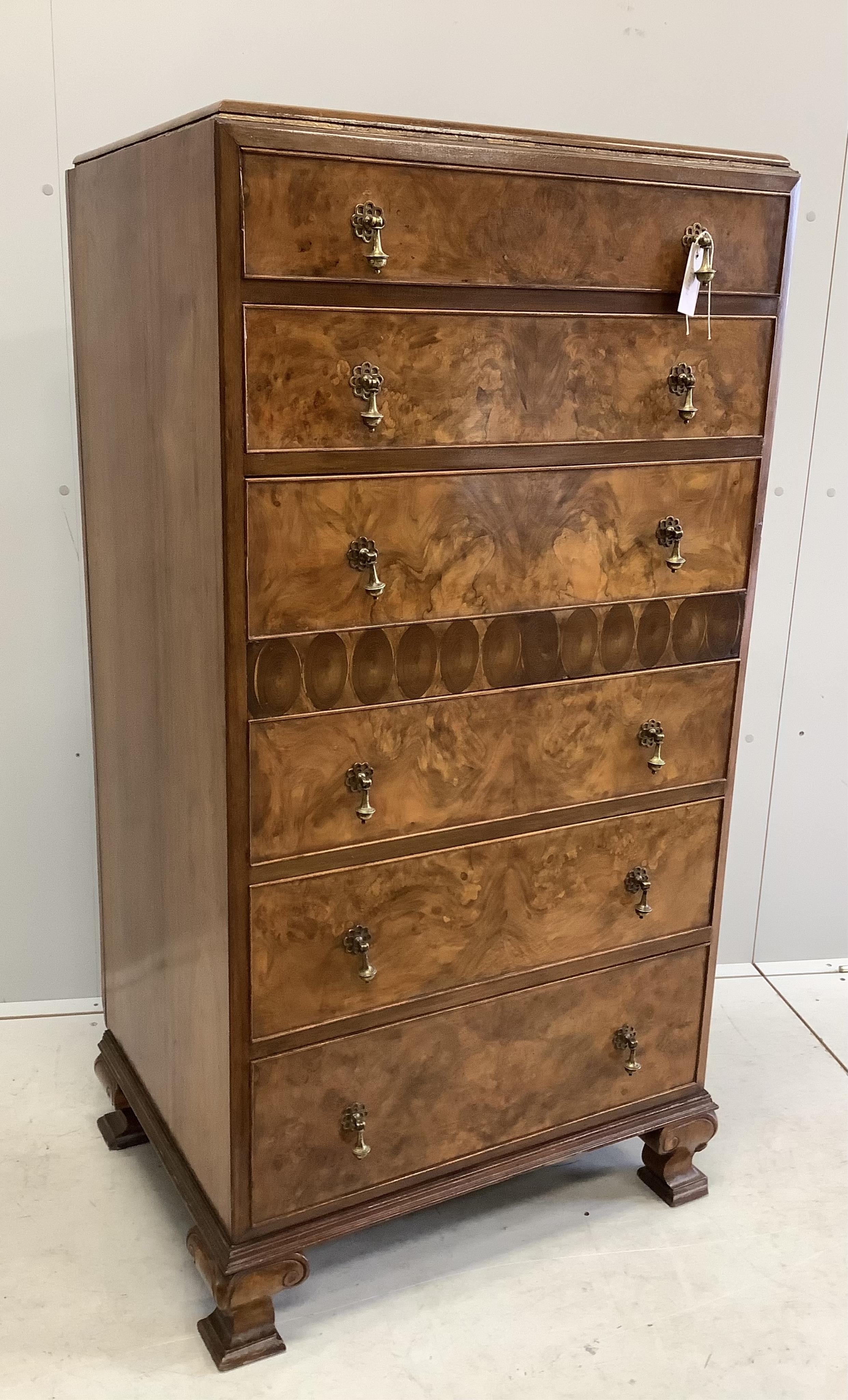 A Queen Anne Revival figured walnut and laburnam oyster veneered six drawer tall chest, width 70cm, depth 53cm, height 134cm. Condition - good